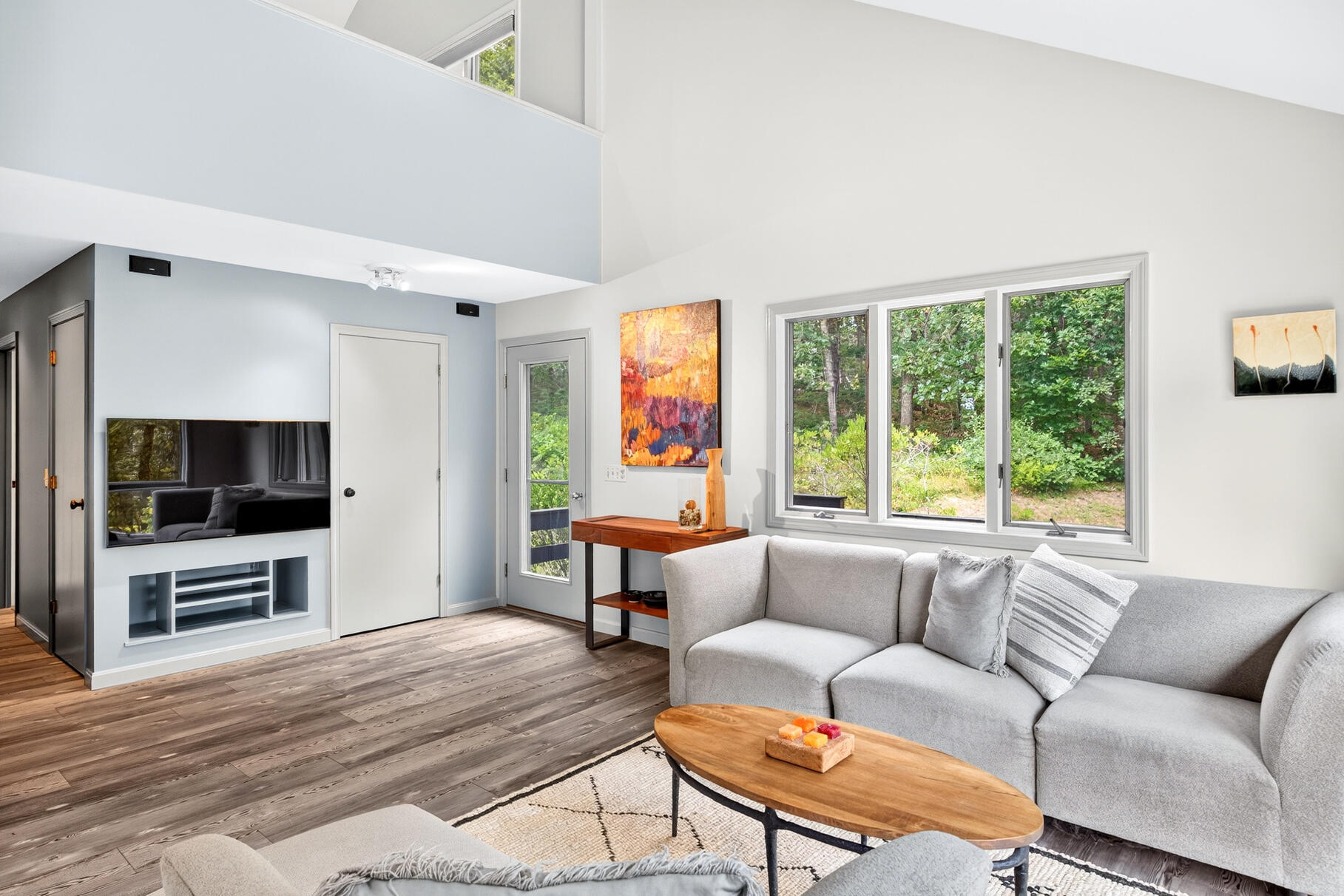 7 Fishermans Road Truro, MA 02666 - Photo 5 of 42 a living room with furniture flat screen tv and a large window