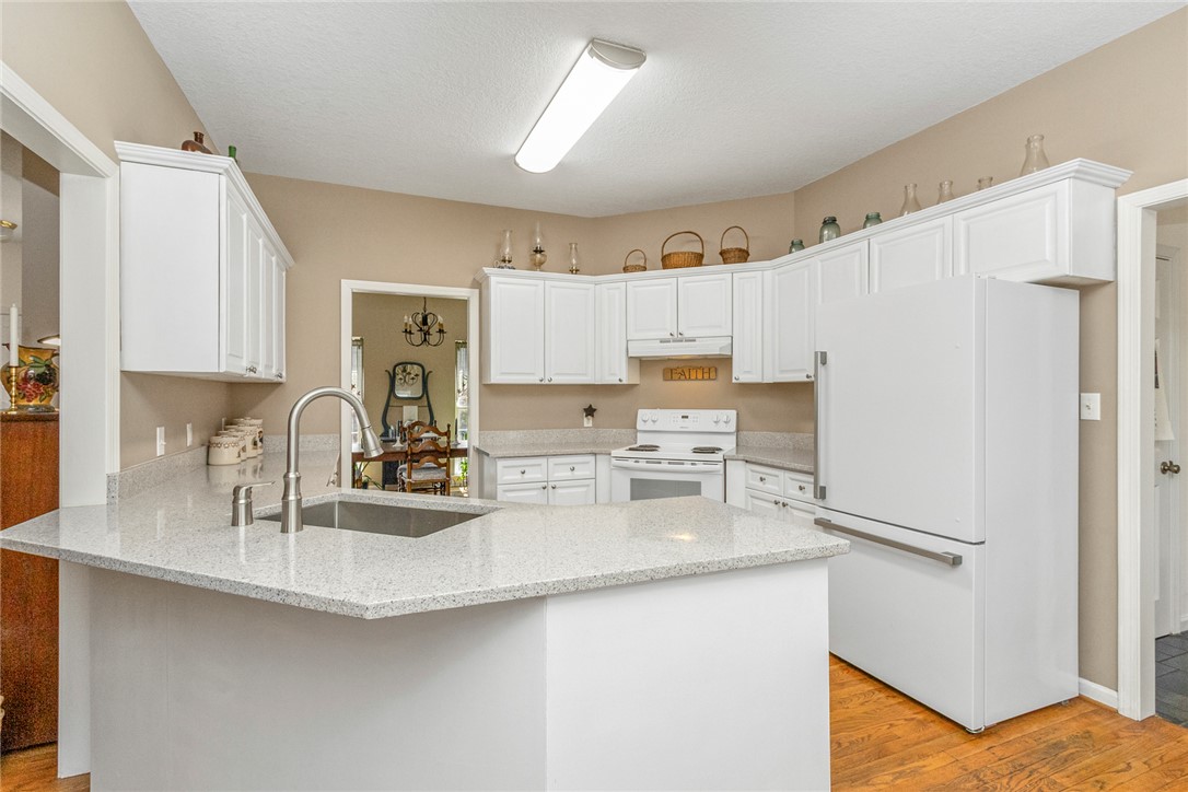 108 Pearman Drive Pendleton, SC 29670 - Photo 10 of 50 This spacious kitchen offers a large island with ample counter space, perfect for culinary endeavors.