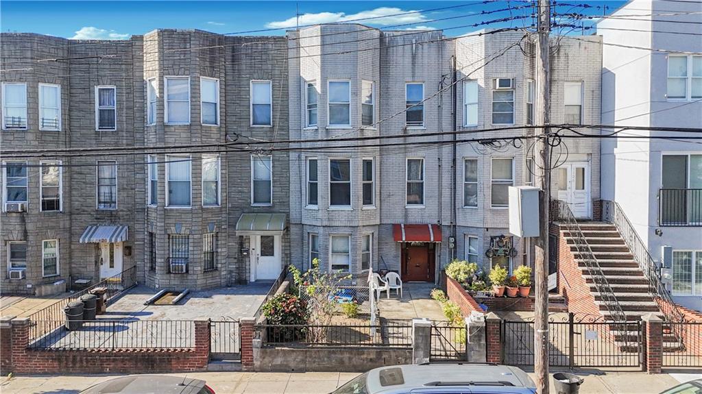 1122 39th Street Brooklyn, NY 11218 - Photo 23 of 27 a front view of a building with street view