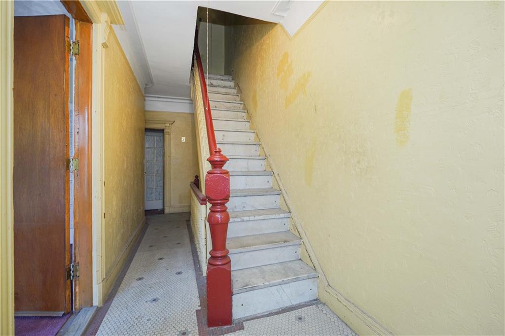 1122 39th Street Brooklyn, NY 11218 - Photo 5 of 27 a view of entryway and hall with wooden floor