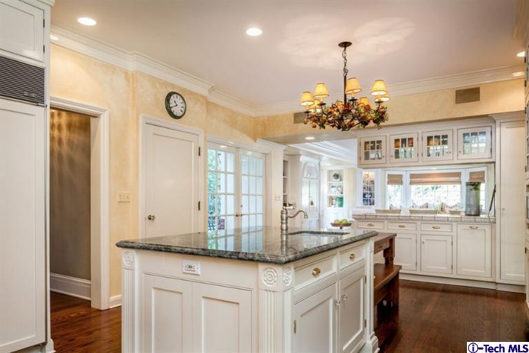 445 Prospect Square Pasadena, CA 91103 - Photo 17 of 45 a kitchen with kitchen island granite countertop a stove and a sink