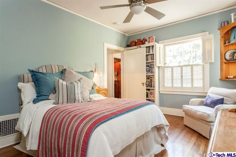 445 Prospect Square Pasadena, CA 91103 - Photo 29 of 45 a spacious bedroom with a bed and wooden floor