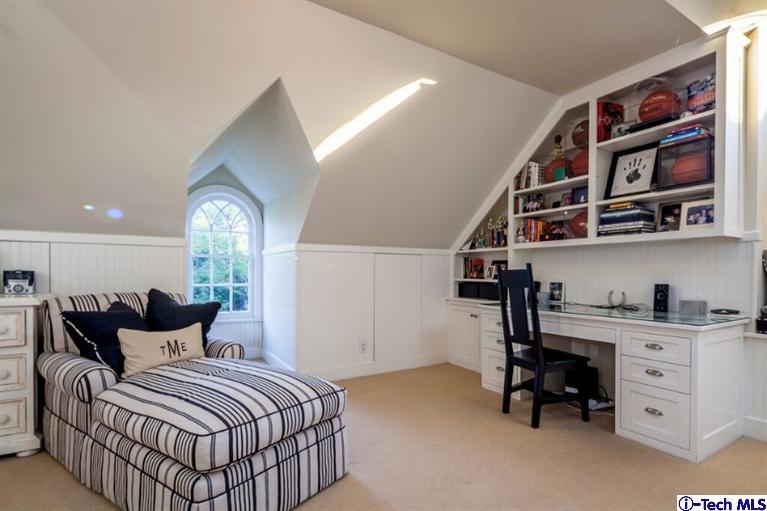 445 Prospect Square Pasadena, CA 91103 - Photo 38 of 45 a bedroom with a bed and a book shelf