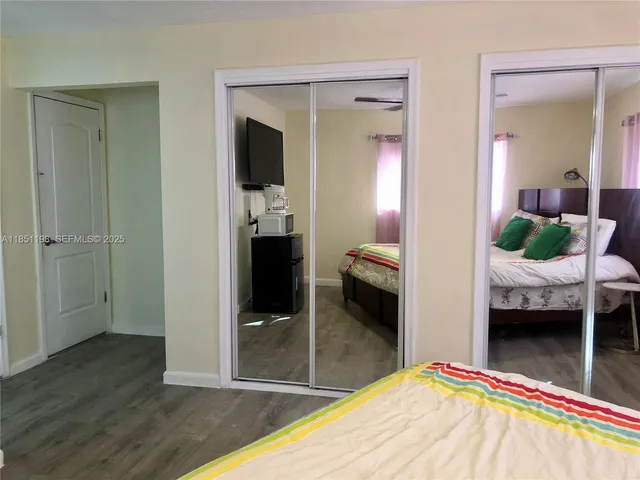 a en suite bathroom with a sink and mirror
