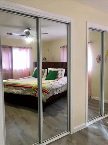 a bathroom with a tub and view of bathroom