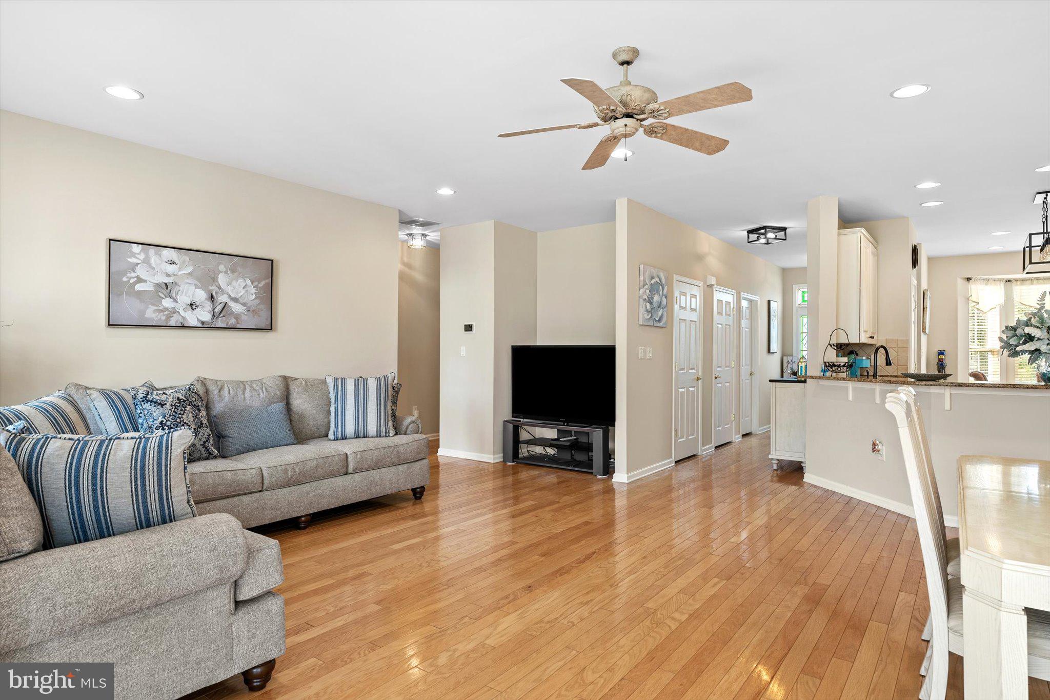 87 Chamber Lane Columbus, NJ 08022 - Photo 14 of 42 a living room with furniture and a flat screen tv with kitchen view