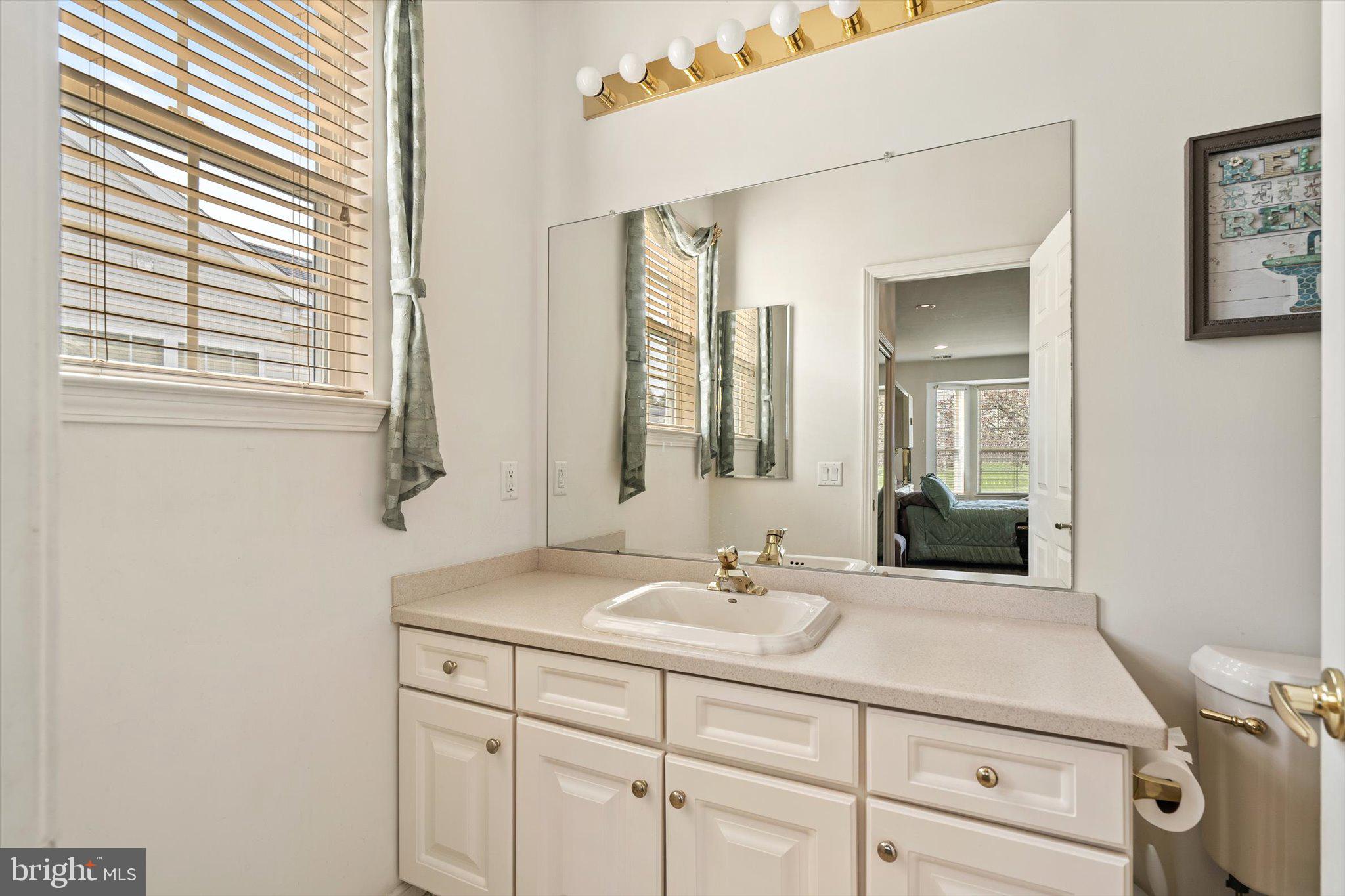 87 Chamber Lane Columbus, NJ 08022 - Photo 17 of 42 a bathroom with a sink and a mirror