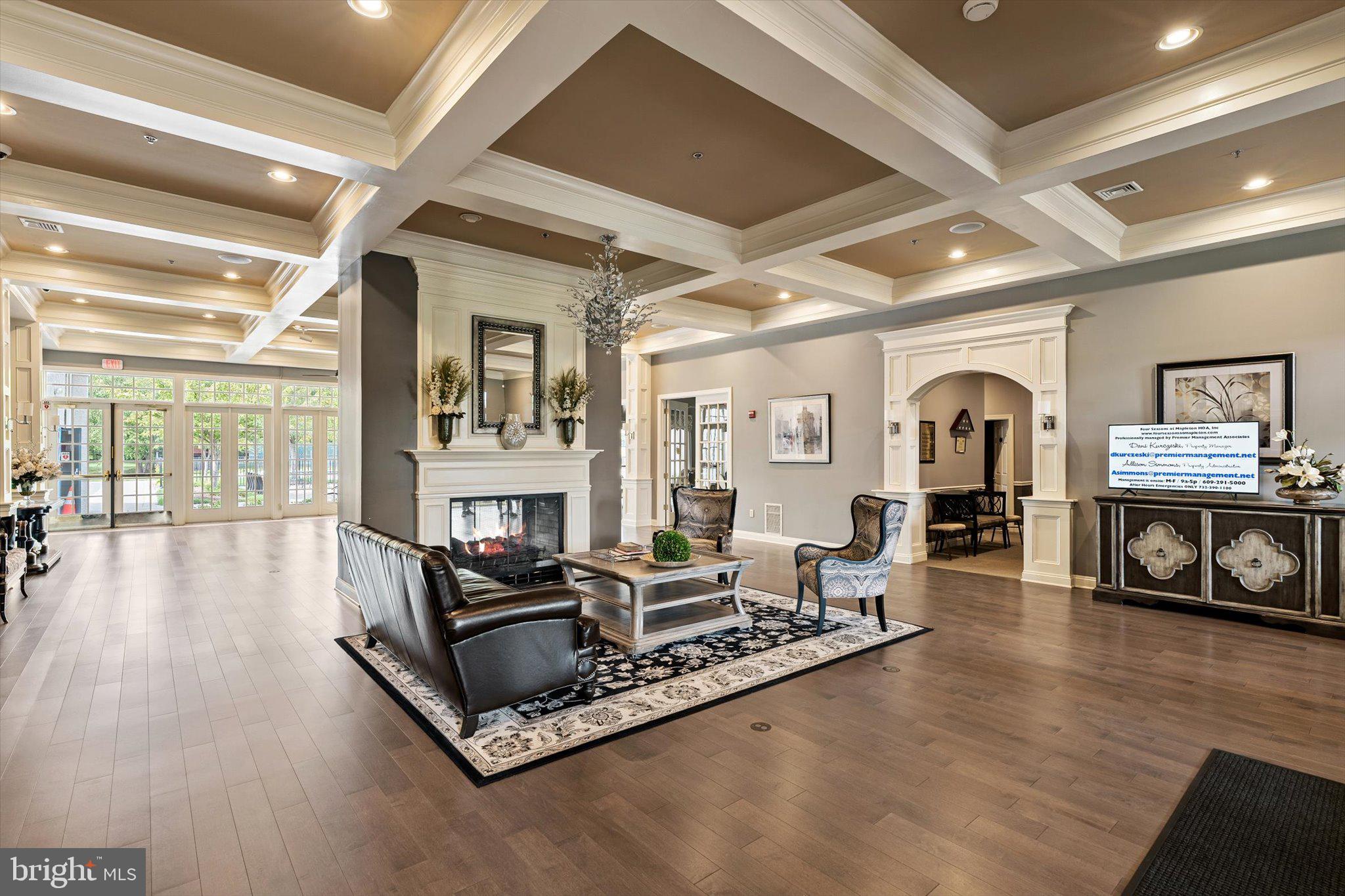 87 Chamber Lane Columbus, NJ 08022 - Photo 31 of 42 a living room with furniture floor to ceiling window and a flat screen tv
