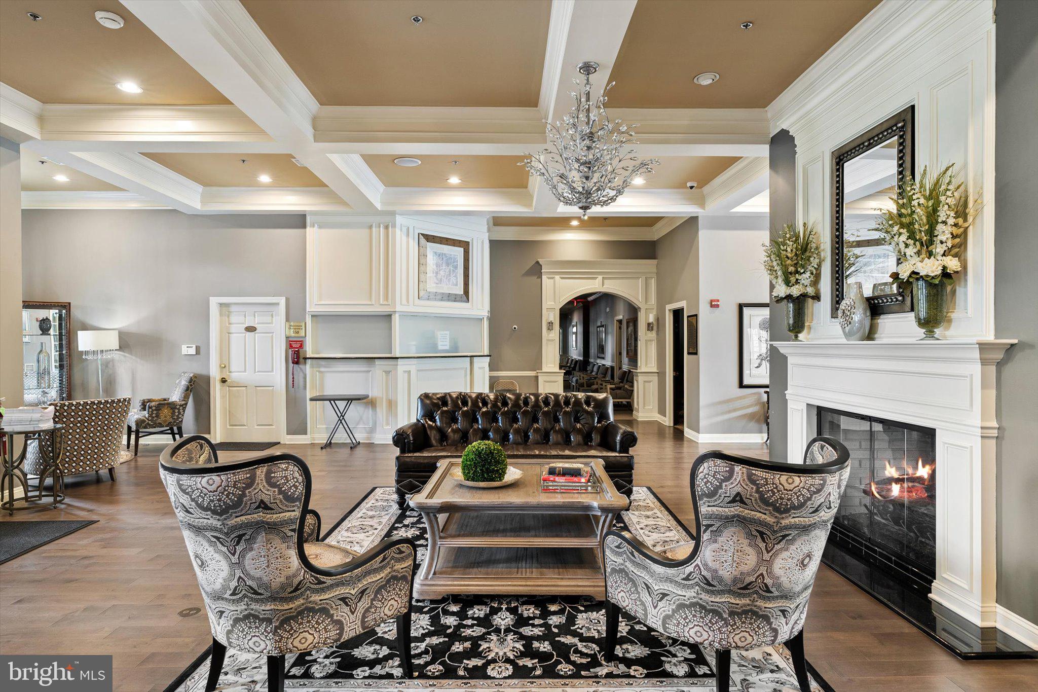 87 Chamber Lane Columbus, NJ 08022 - Photo 32 of 42 a living room with furniture a chandelier and fireplace