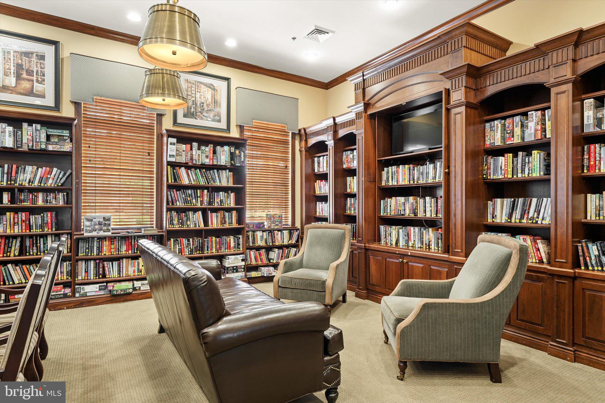87 Chamber Lane Columbus, NJ 08022 - Photo 35 of 42 a living room with furniture a rug and a book shelf