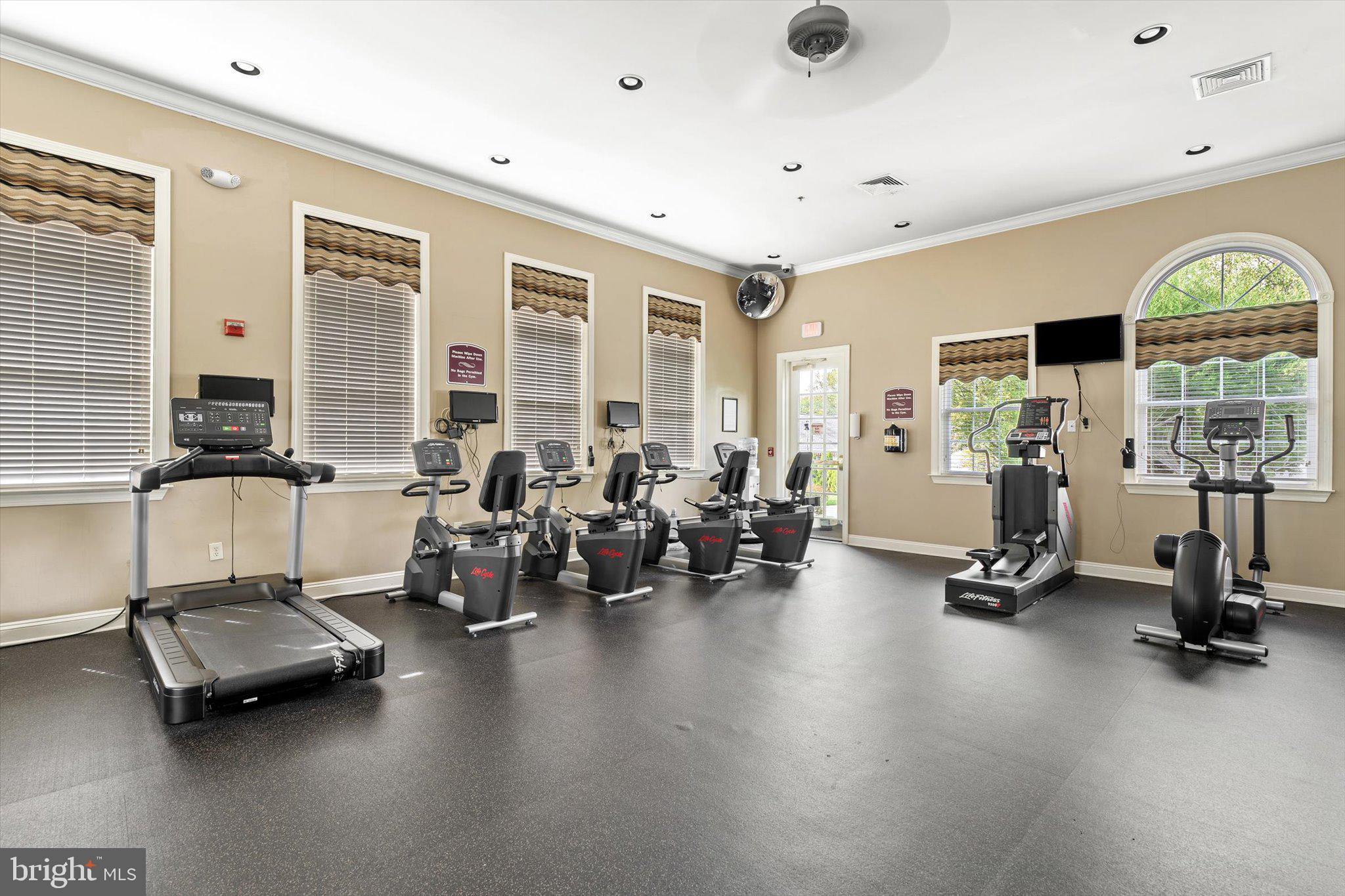 87 Chamber Lane Columbus, NJ 08022 - Photo 38 of 42 a room with gym equipment and a large window