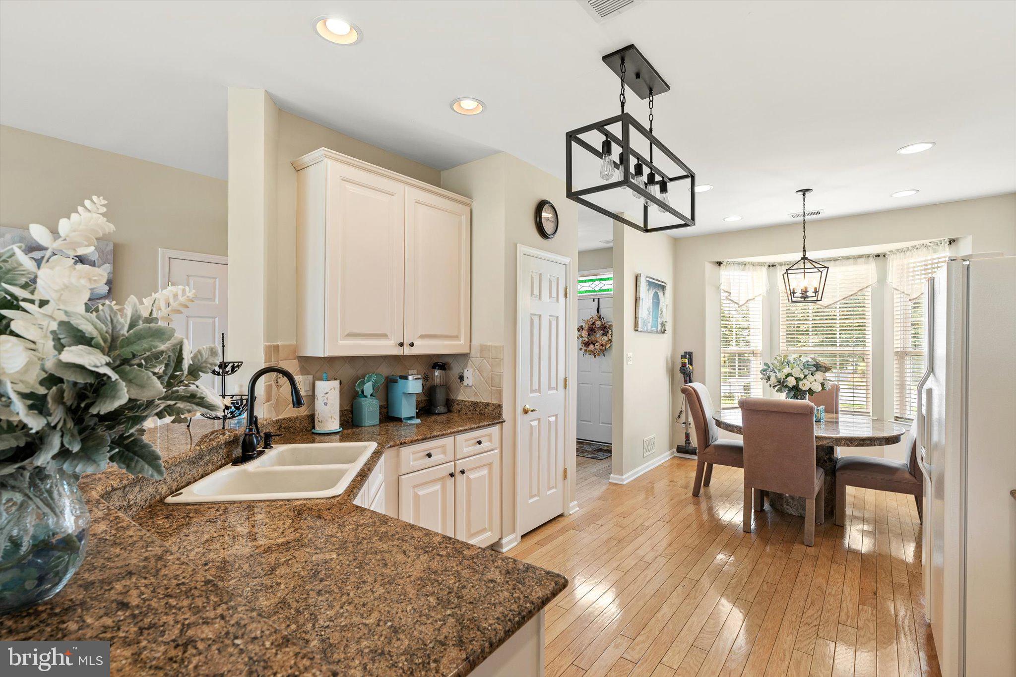 87 Chamber Lane Columbus, NJ 08022 - Photo 7 of 42 a very nice looking dining room with a large window and wooden floor