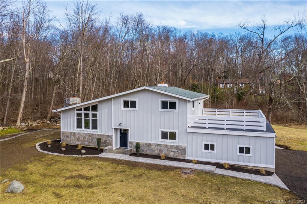 57 Tower Road Brookfield, CT 06804 - Photo 1 of 1 a view of a house with pool and sitting area