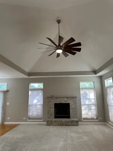 a living room with fireplace furniture and a window