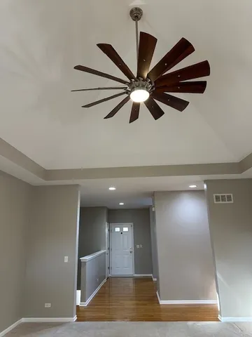 a view of room with a ceiling fan