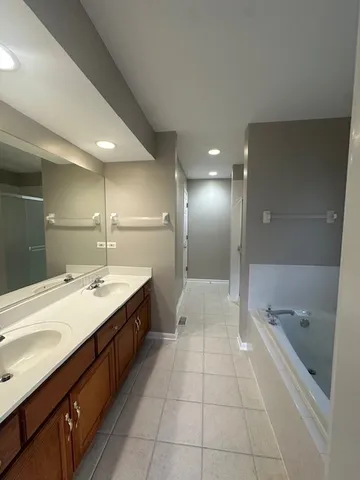 a bathroom with a bathtub and a sink