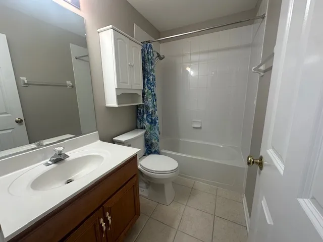 a bathroom with a bath tub with a shower