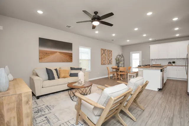 a kitchen with a sink a stove and cabinets