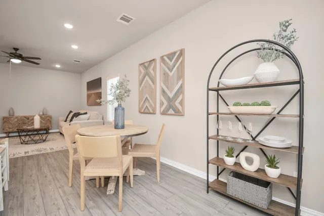 a bathroom with a sink mirror and vanity