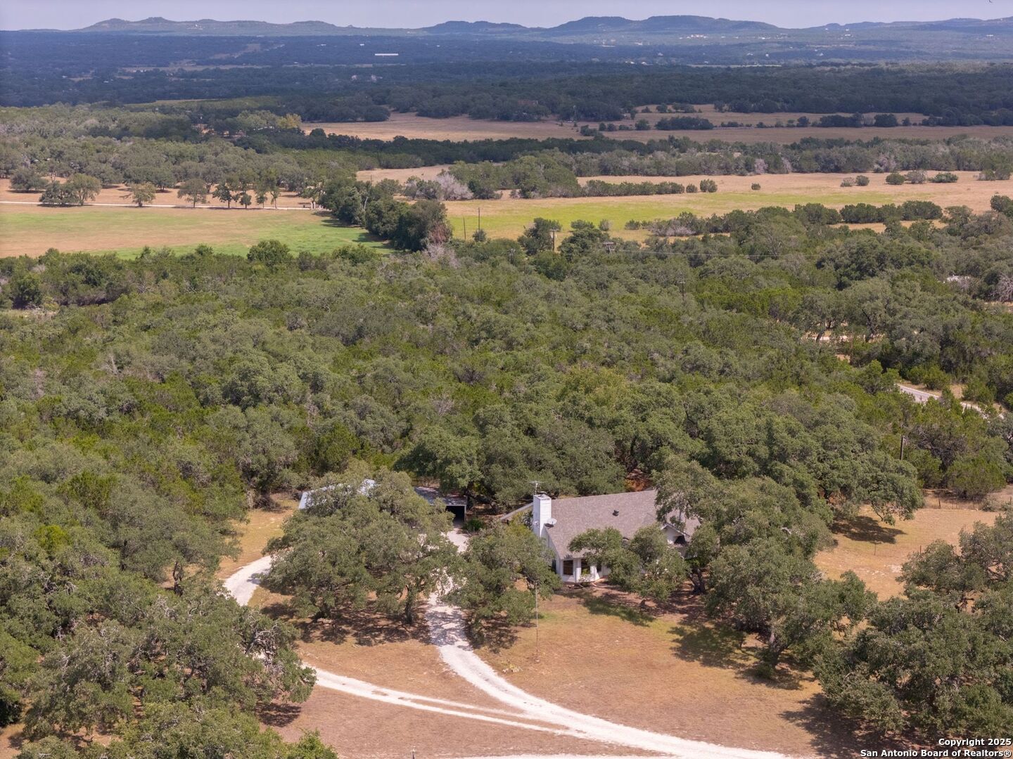 a view of a city and mountains ocean view