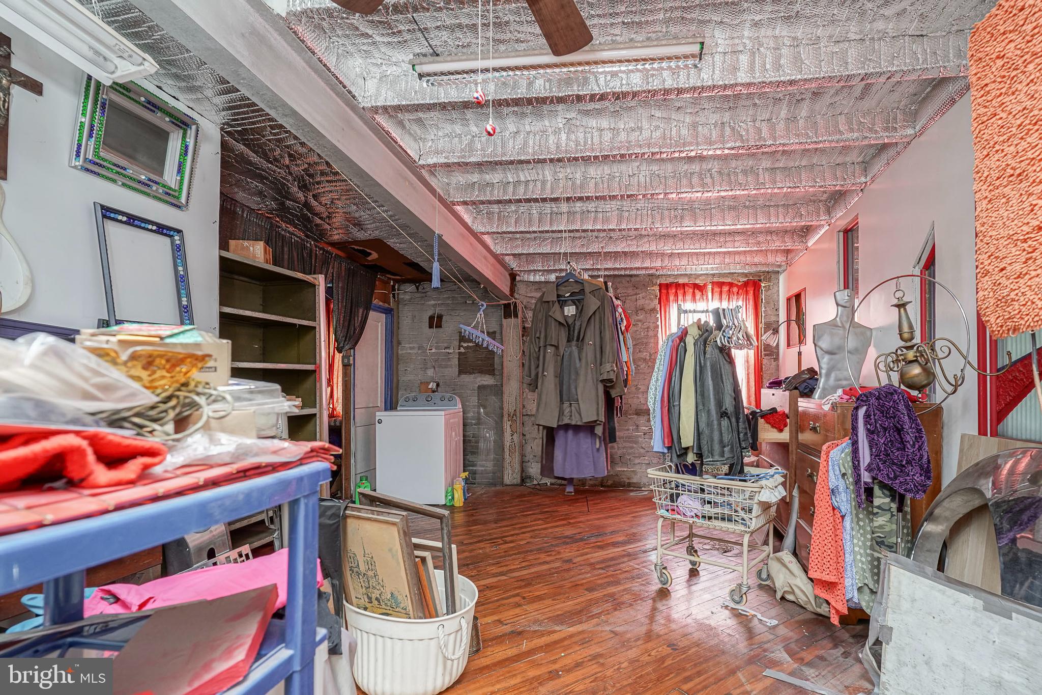 2416 East Sergeant Street Philadelphia, PA 19125 - Photo 13 of 19 a view of walk in closet with clothes and shoes