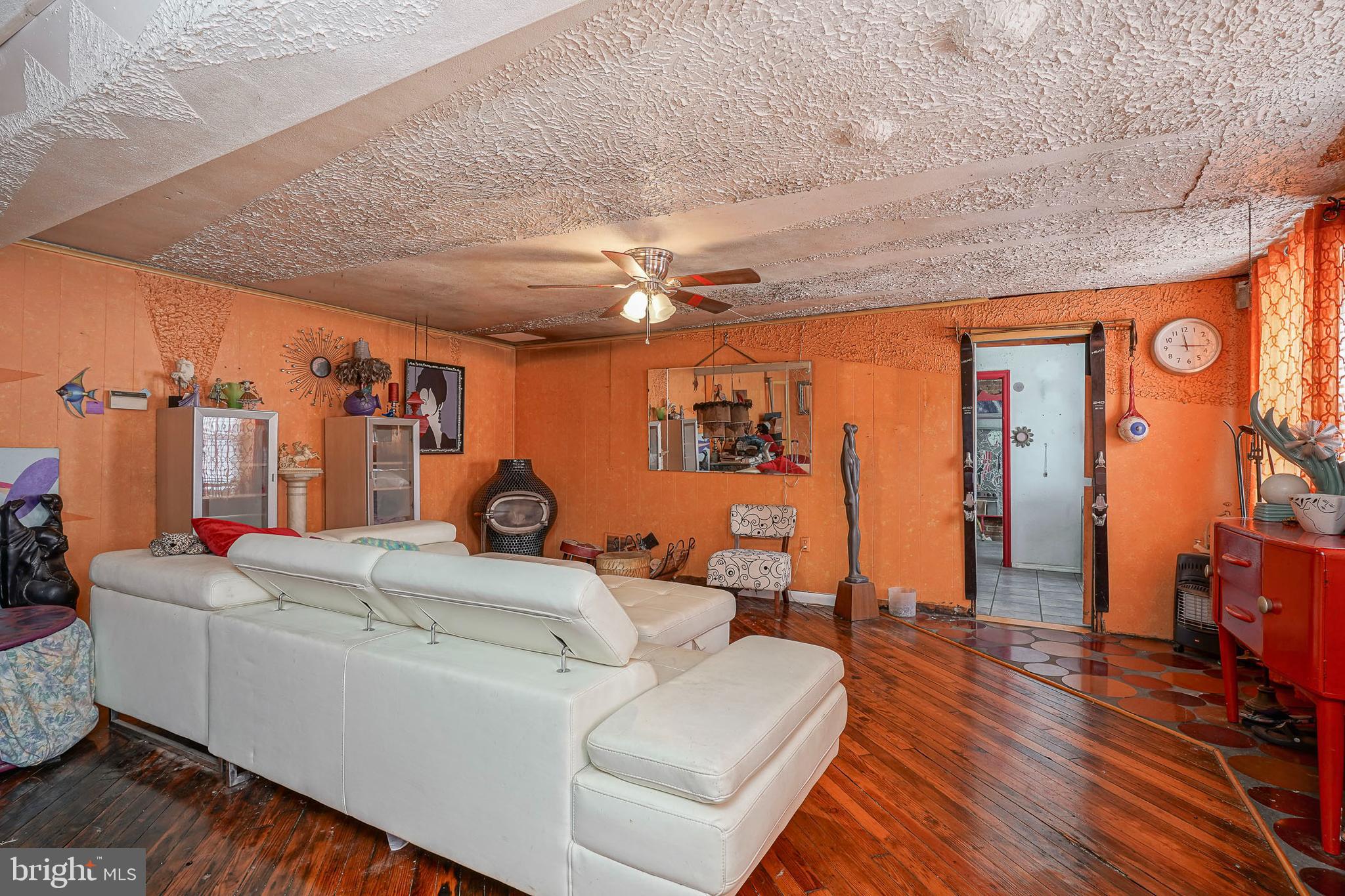 2416 East Sergeant Street Philadelphia, PA 19125 - Photo 4 of 19 a living room with furniture a ceiling fan and a rug