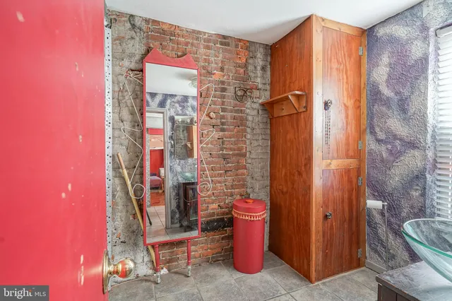 a bathroom with a toilet and shower