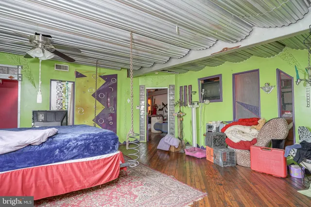 a bedroom with bed and a window