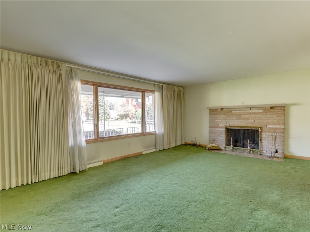 316 Everhard Road Southwest North Canton, OH 44709 - Photo 11 of 28 The 23x13 family room features a large picture window that overlooks the gorgeous front yard, as well as a fireplace with stone surround.