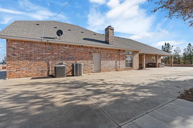 front view of a house with a basket ball court