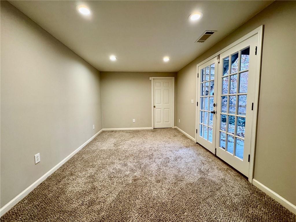 5450 Heathridge Terrace Johns Creek, GA 30097 - Photo 30 of 30 a view of an empty room with a staircase