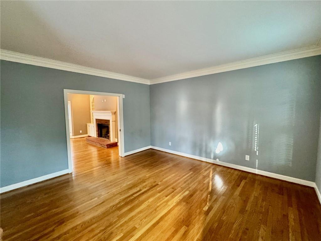 5450 Heathridge Terrace Johns Creek, GA 30097 - Photo 4 of 30 a view of empty room with wooden floor and fan