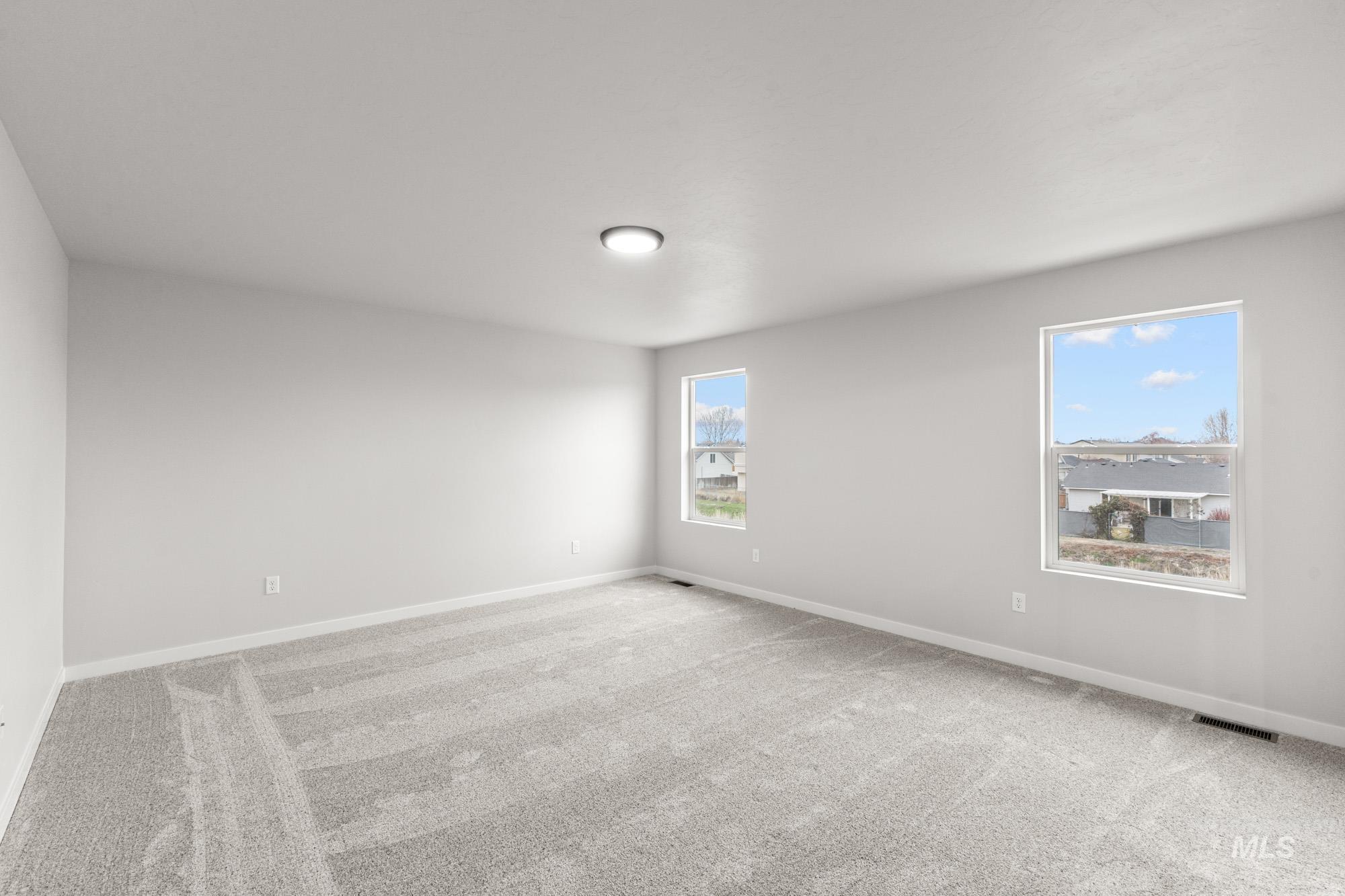 3030 South Maple Rnch Way Nampa, ID 83686 - Photo 18 of 21 Unfurnished room featuring light colored carpet and baseboards