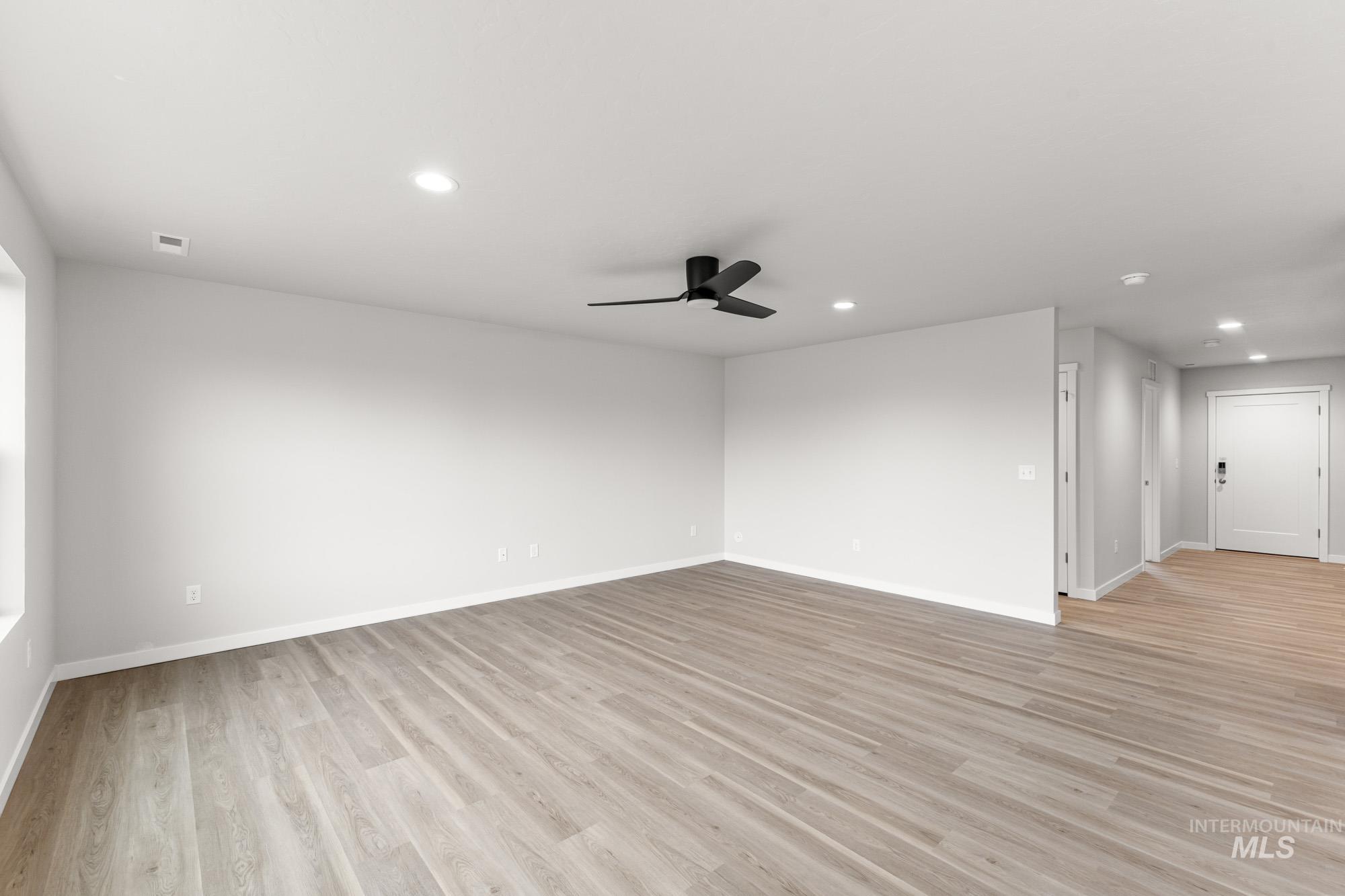 3030 South Maple Rnch Way Nampa, ID 83686 - Photo 8 of 21 Unfurnished room featuring recessed lighting, ceiling fan, and light wood-style flooring