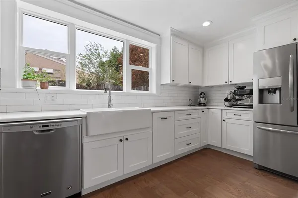 a living room with a bed and furniture