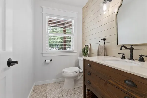 a spacious bedroom with a large bed and a window