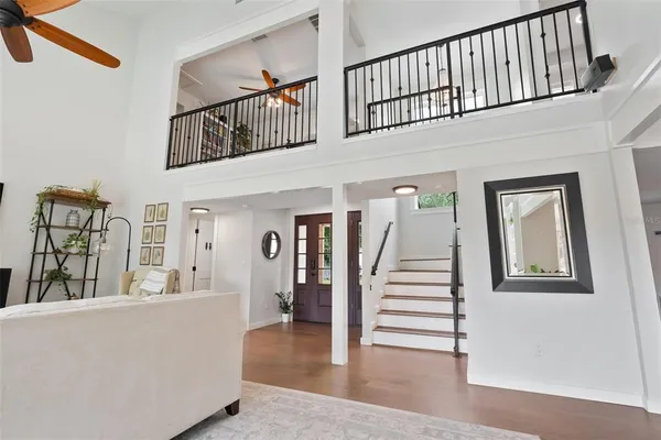 a kitchen with stainless steel appliances kitchen island granite countertop a stove and a view of living room