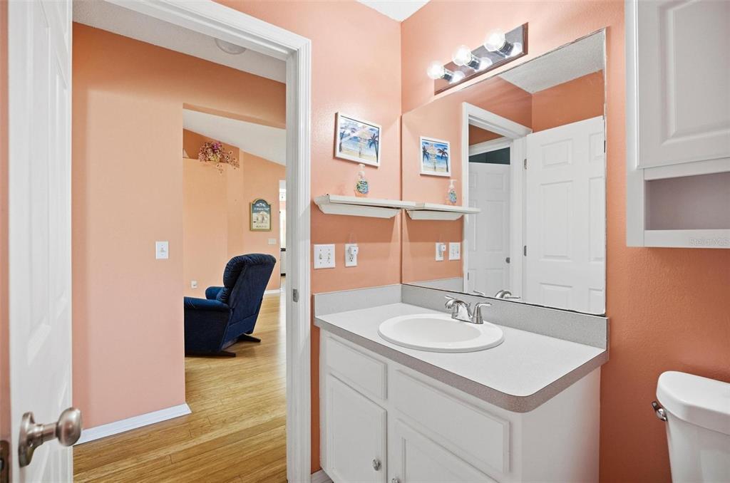 96 Ullian Trail Palm Coast, FL 32164 - Photo 23 of 42 a bathroom with a sink vanity granite and a mirror