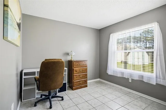 a workspace with furniture and a window