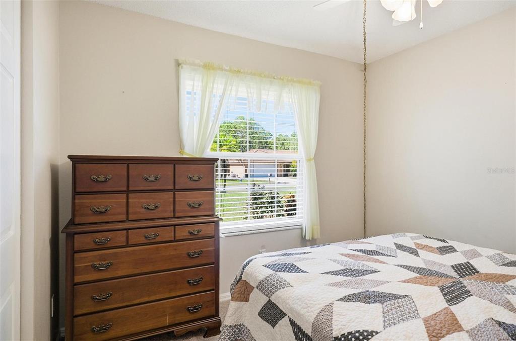 96 Ullian Trail Palm Coast, FL 32164 - Photo 28 of 42 a bedroom with a bed and a window