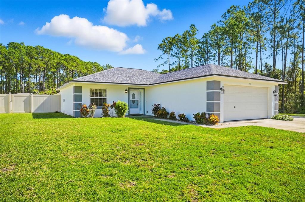 96 Ullian Trail Palm Coast, FL 32164 - Photo 3 of 42 a view of a house with a backyard