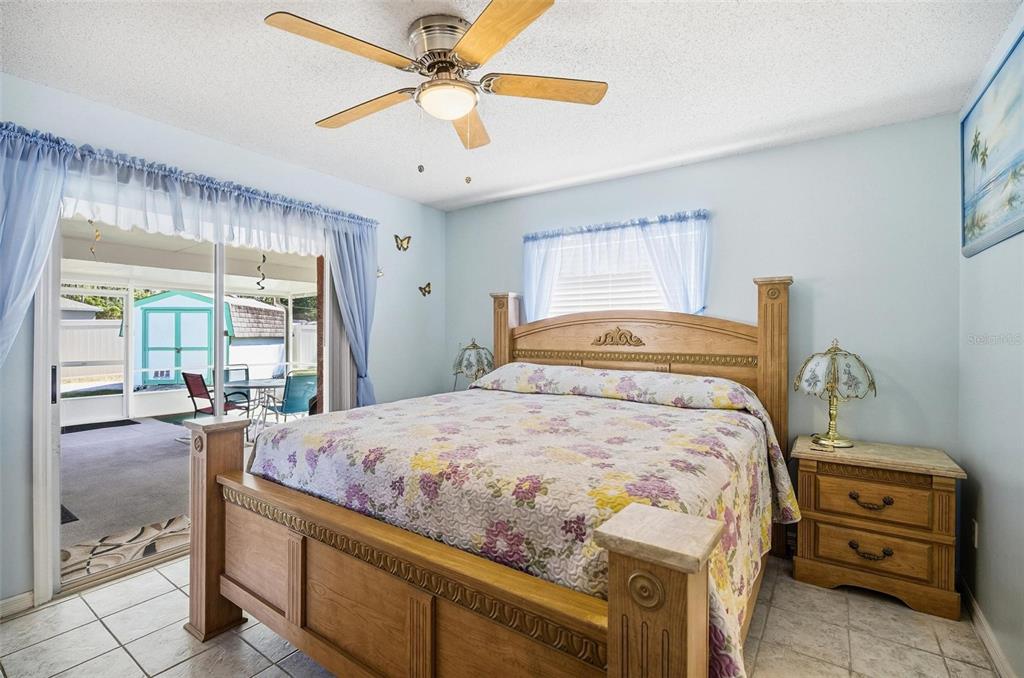 96 Ullian Trail Palm Coast, FL 32164 - Photo 31 of 42 a bedroom with a bed and wooden floor