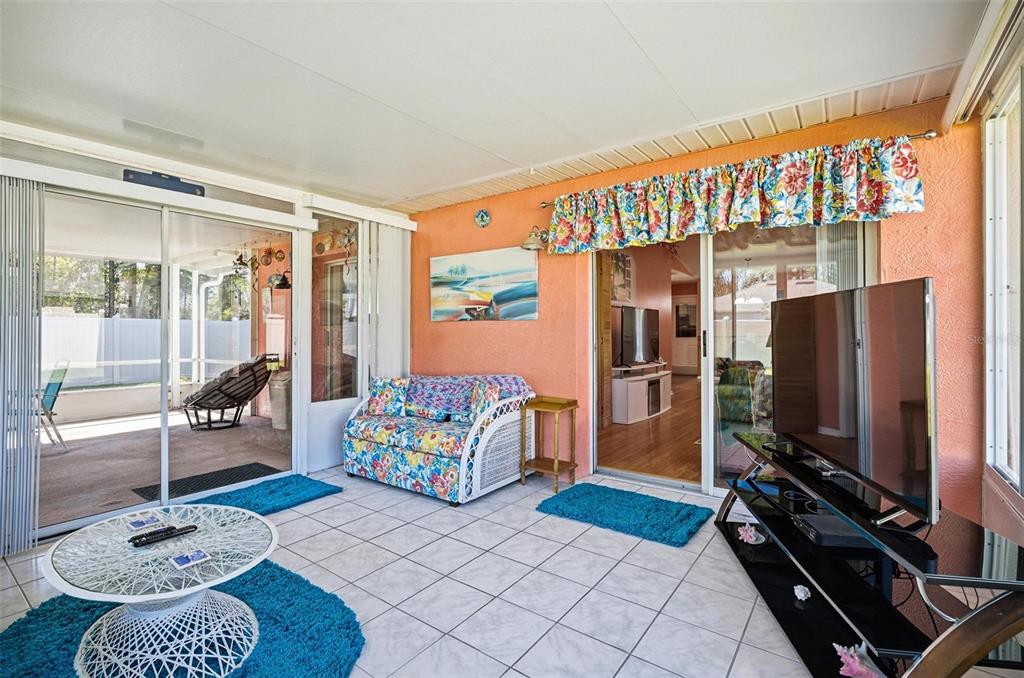 96 Ullian Trail Palm Coast, FL 32164 - Photo 33 of 42 a living room with furniture and a flat screen tv
