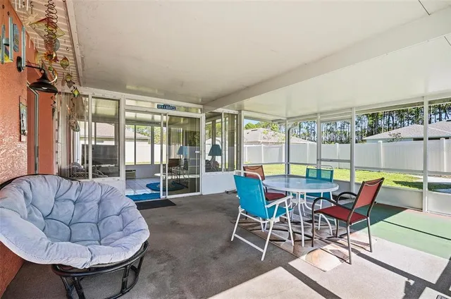 a view of a livingroom with furniture and a table