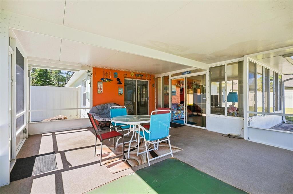 96 Ullian Trail Palm Coast, FL 32164 - Photo 37 of 42 a living room with a large window and furniture
