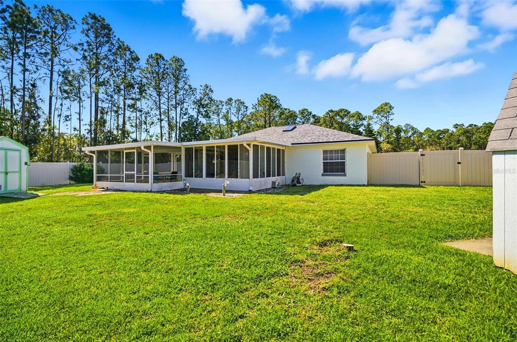 96 Ullian Trail Palm Coast, FL 32164 - Photo 41 of 42 a view of a house with a backyard