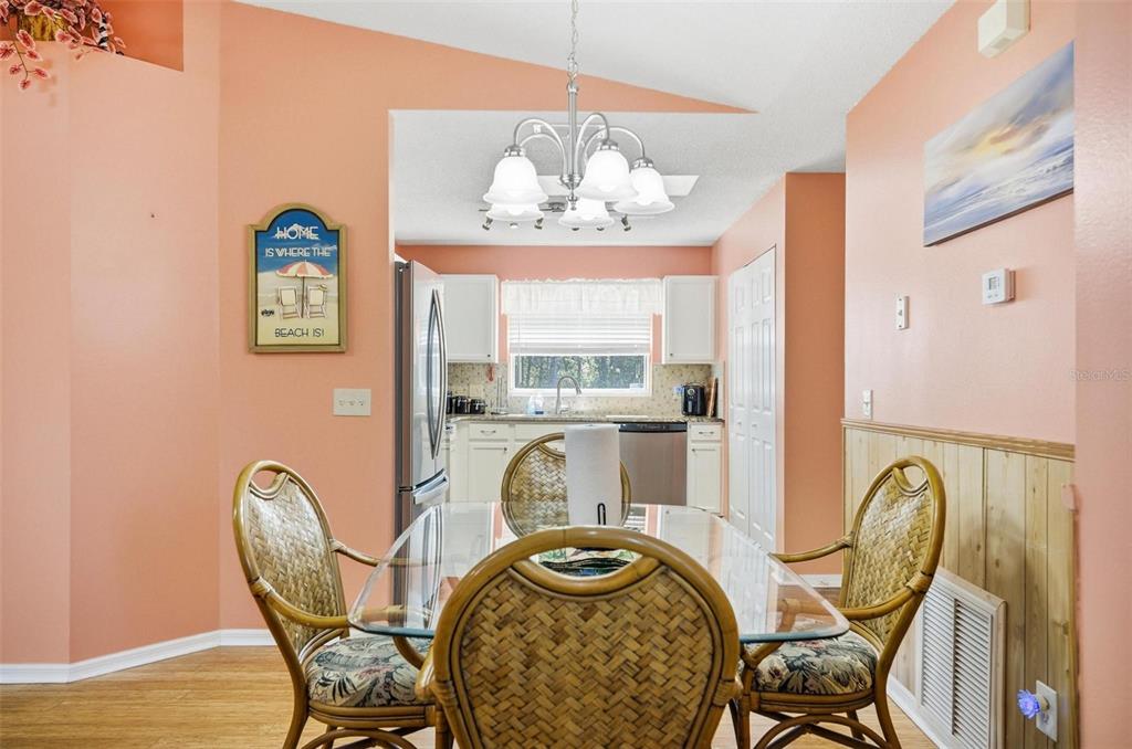 96 Ullian Trail Palm Coast, FL 32164 - Photo 7 of 42 a view of a dining room with furniture window and outside view