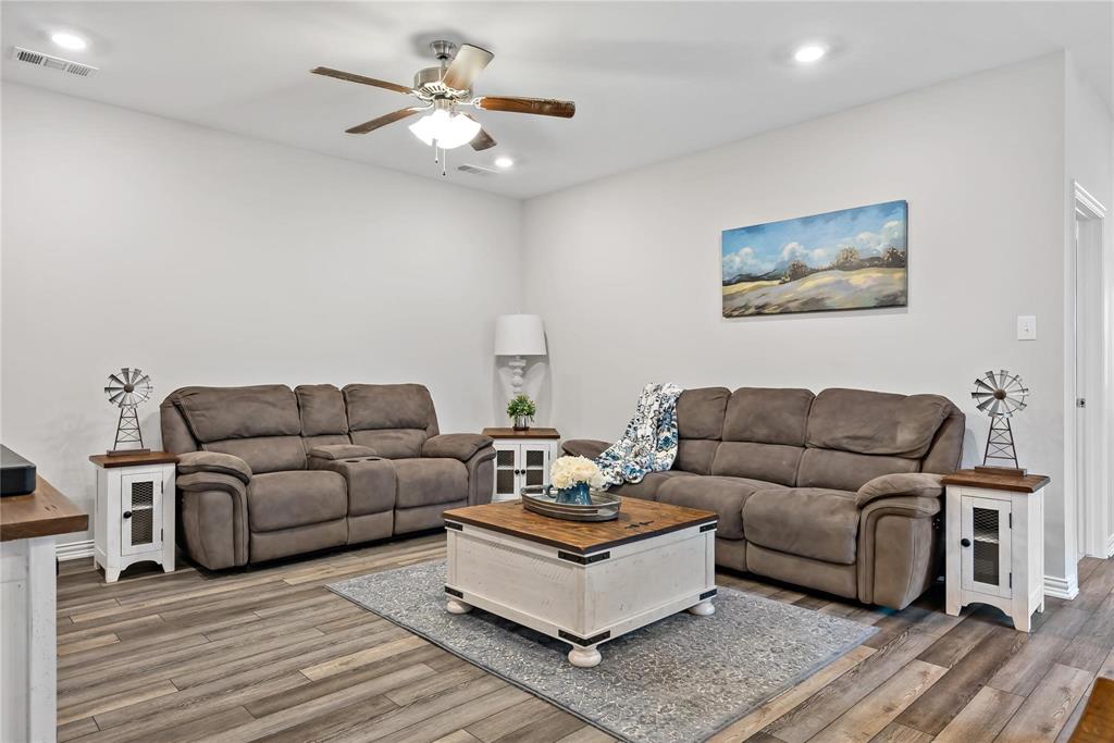 2003 Atlantic Avenue Anna, TX 75409 - Photo 13 of 22 a living room with furniture and a wooden floor