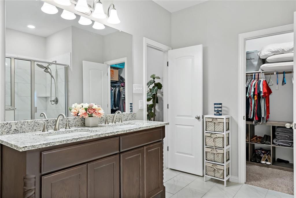 2003 Atlantic Avenue Anna, TX 75409 - Photo 15 of 22 a bathroom with a sink vanity and mirror