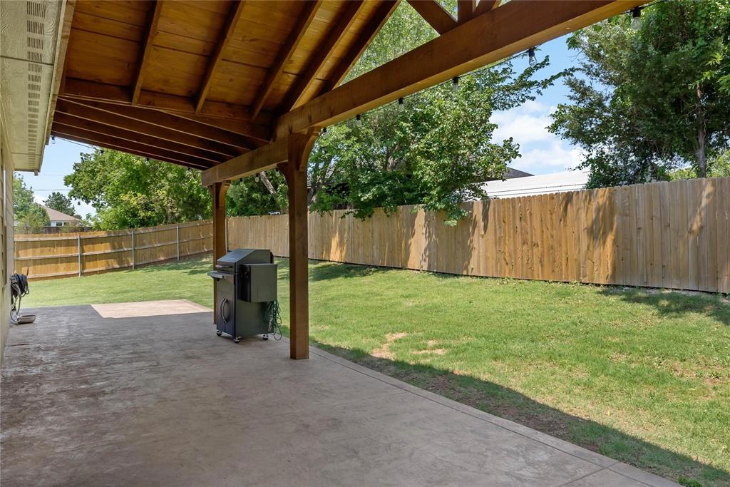 2003 Atlantic Avenue Anna, TX 75409 - Photo 20 of 22 a view of backyard with wooden fence and large trees